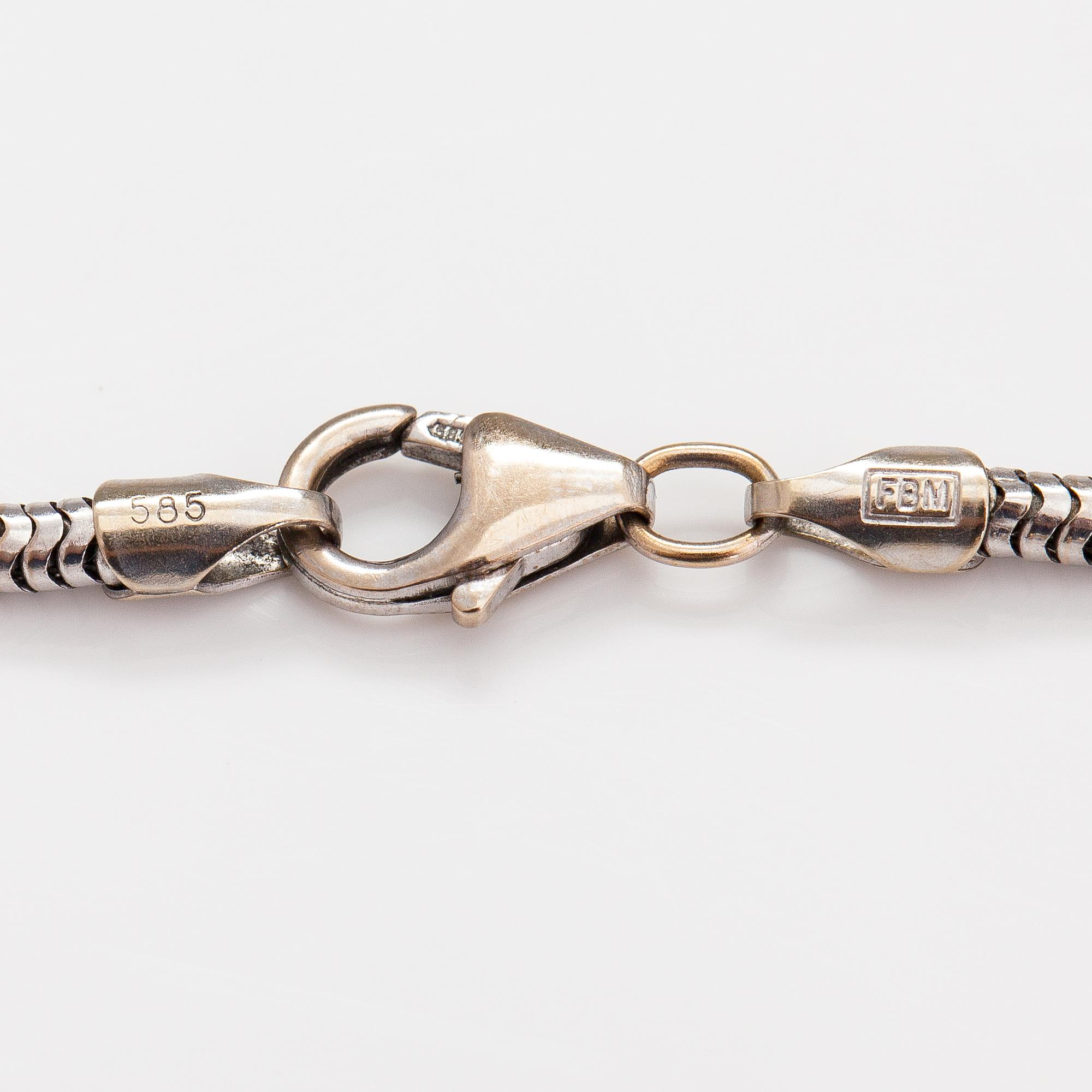 A 14K white and yellow gold bracelet with diamonds ca. 0.03 ct in total.