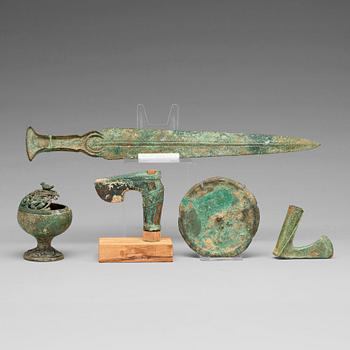 A group of five bronze objects, some Han dynasty (206 BC - 220 AD).