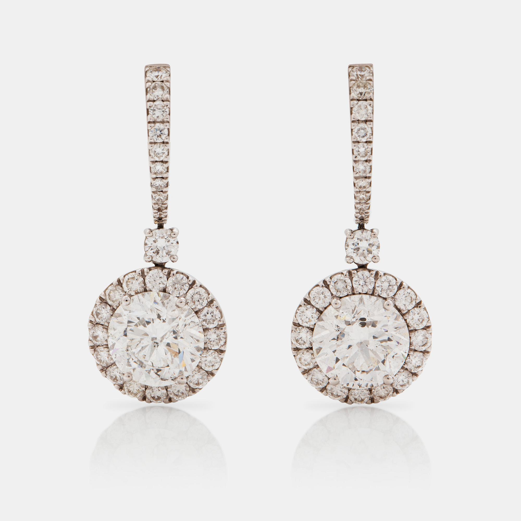A pair of brilliant cut diamond earrings, 2.40 and 2.27 ct. Quality F/SI2 according to certificates from HRD and IGI.