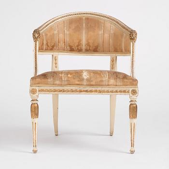 A late Gustavian carved and part-gilt open armchair, late 18th century.