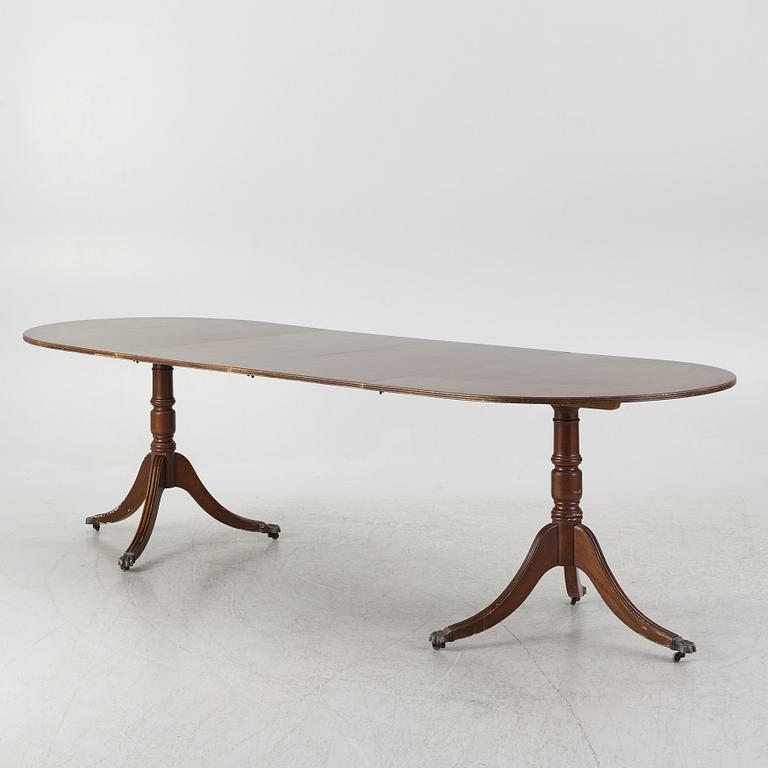 A dining table, 20th century, England.