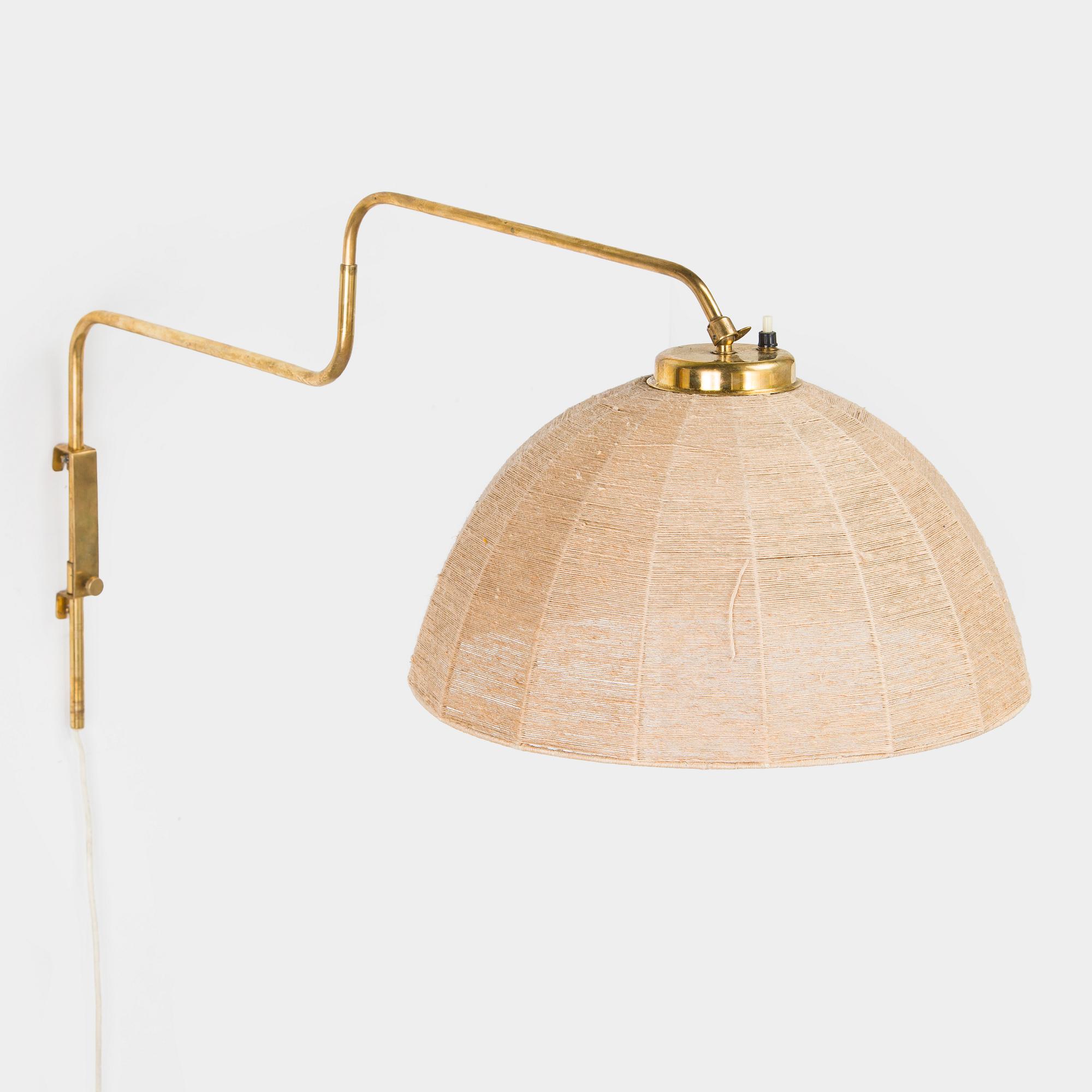 A mid-20th century wall light for Valinte, Finland.