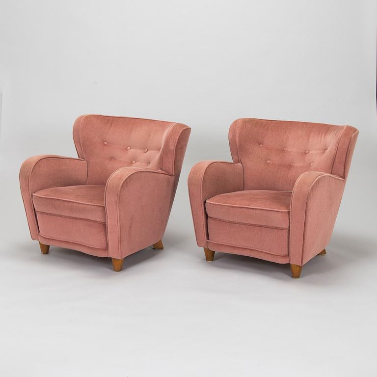 A pair of mid-20th century armchairs.