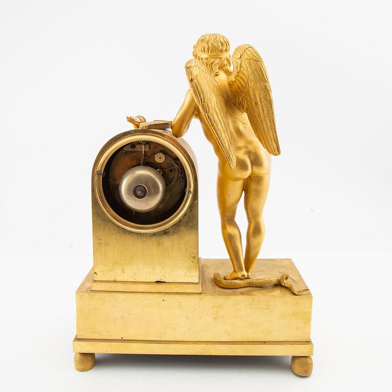 A French Empire ormolu figural mantel clock, early 19th century.