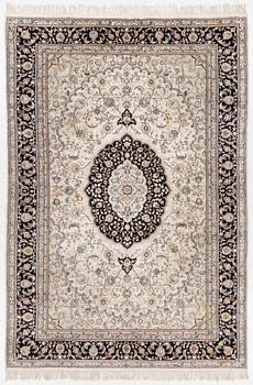 An Oriental rug, approx. 278 x 190 cm.