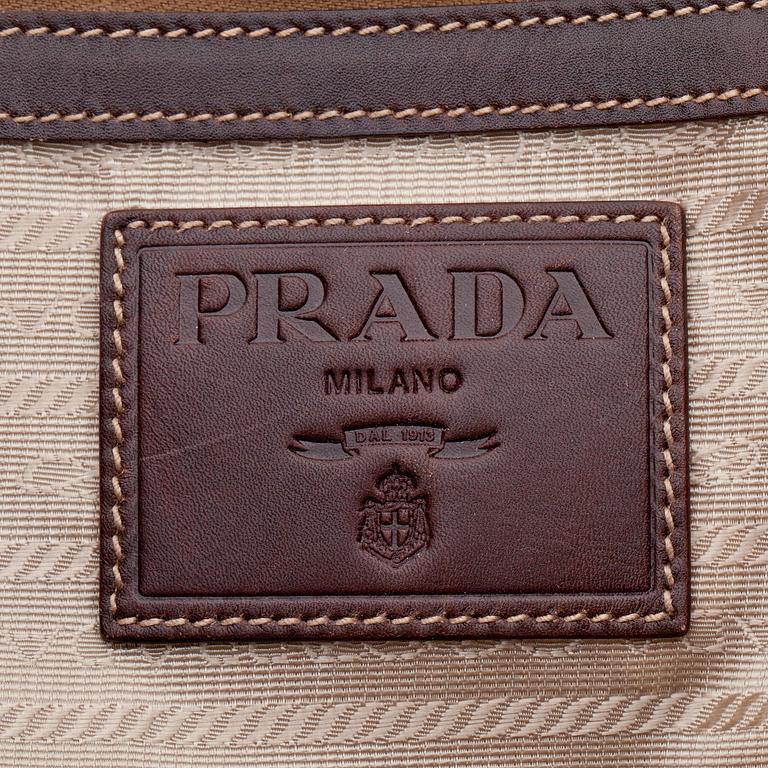 PRADA, a brown canvas and leather shoulderbag.