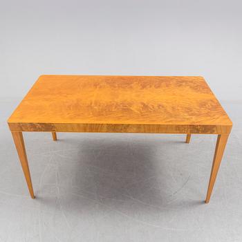 A 1940's dining table an four chairs.