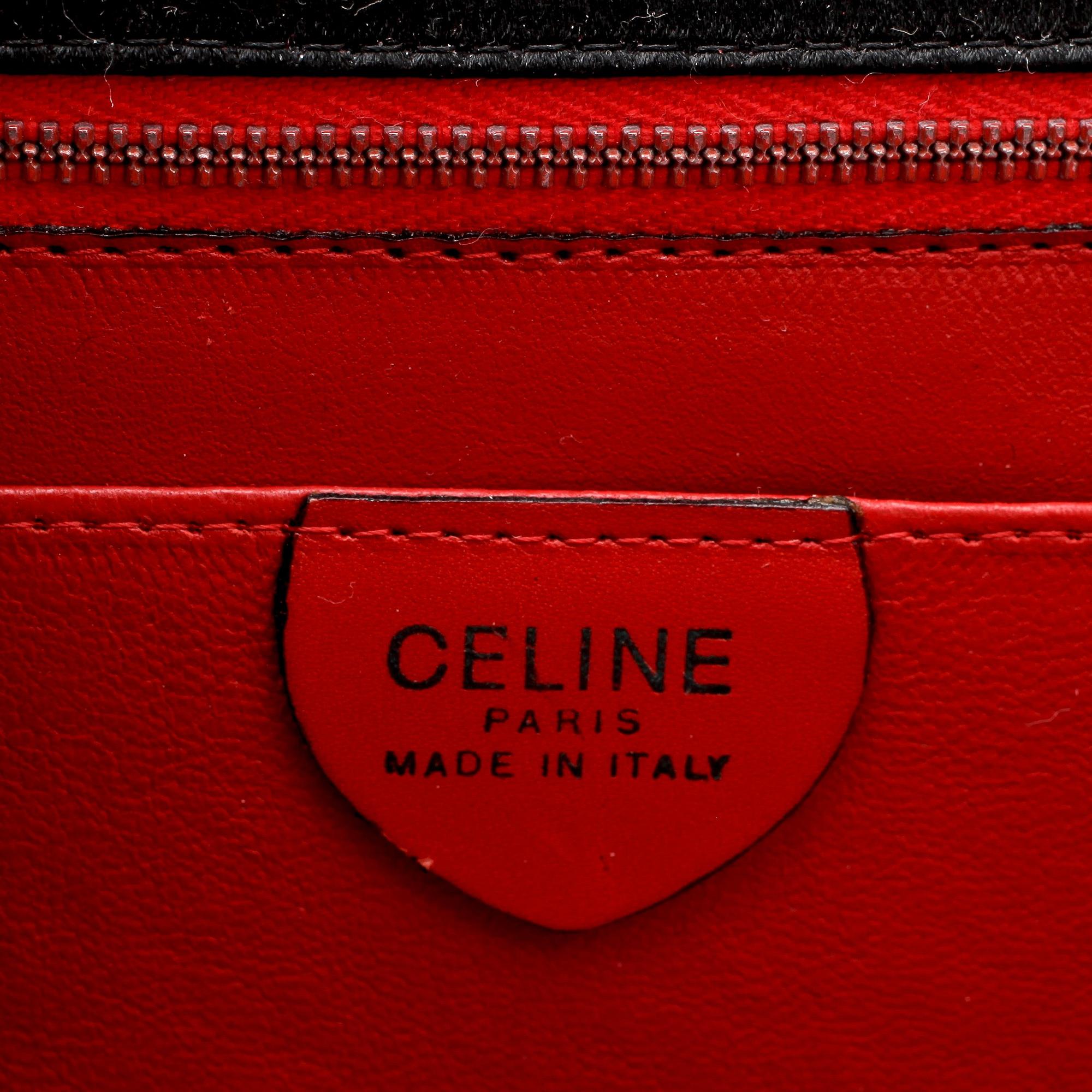 CÉLINE, a black satin eveningbag / clutch.