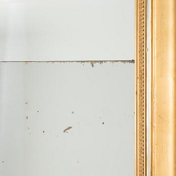 A rococo-style mirror and console table, around 1900.