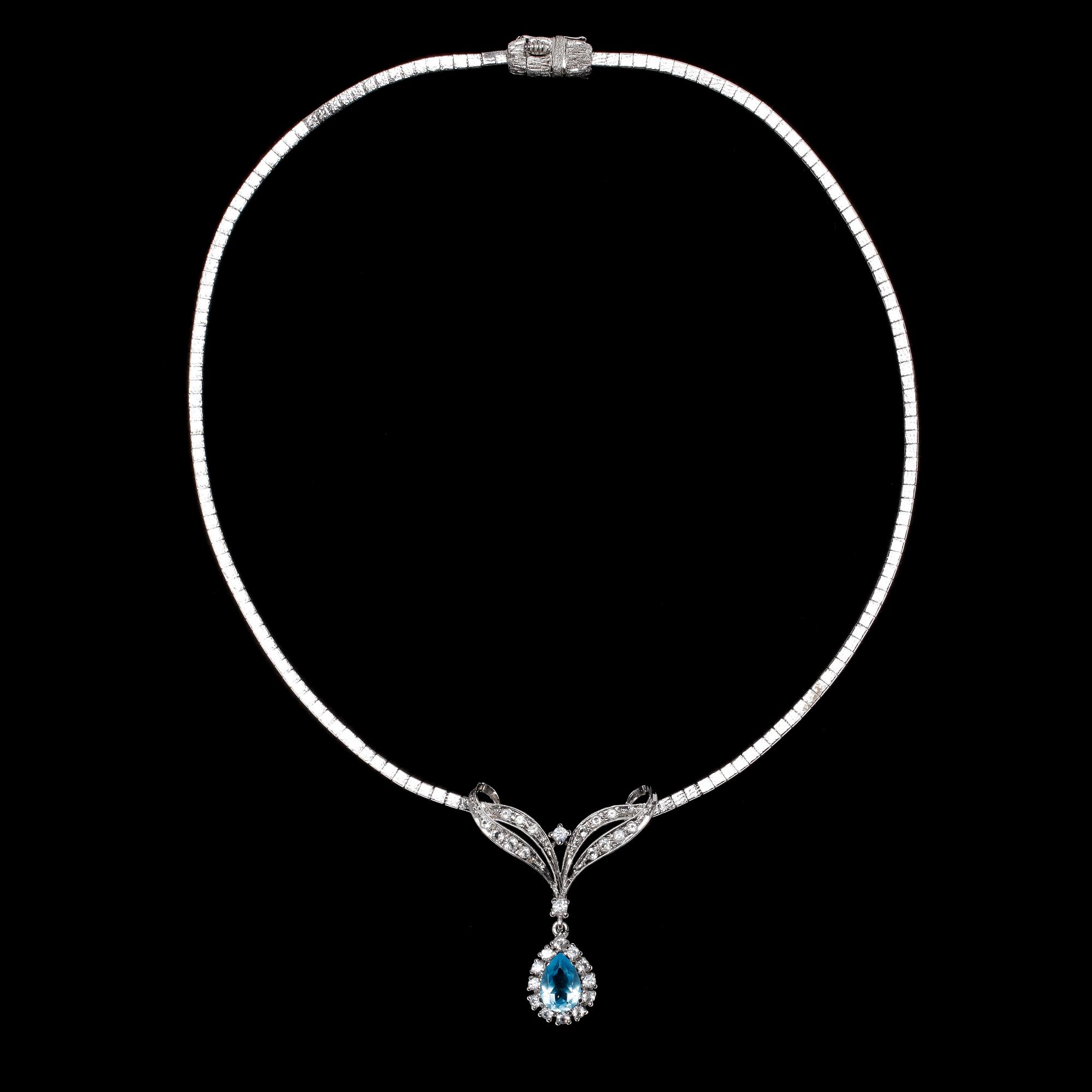 COLLIER, 9k vitguld med droppformad topas och 28 briljantslipade diamanter, tot ca 1 ct. Vikt ca 19,5 gram.