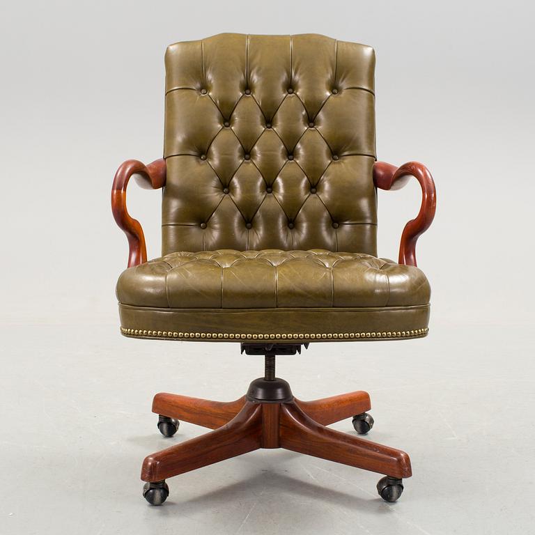 A Chesterfield style sweivel chair, Alex Stuart Design Inc, Chatsworth California USA, late 20th Century.