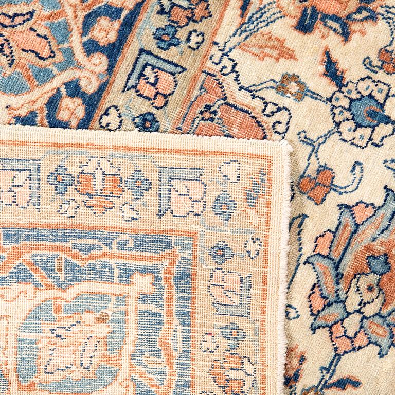 An antique Tabris carpet approx 304x212cm.