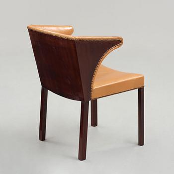 Frits Henningsen, a stained mahogany and brown leather armchair, Denmark.