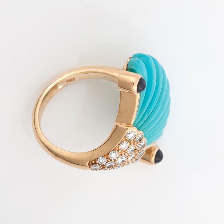 A carved turquoise, cabochon-cut sapphire and diamond ring with matching earrings.