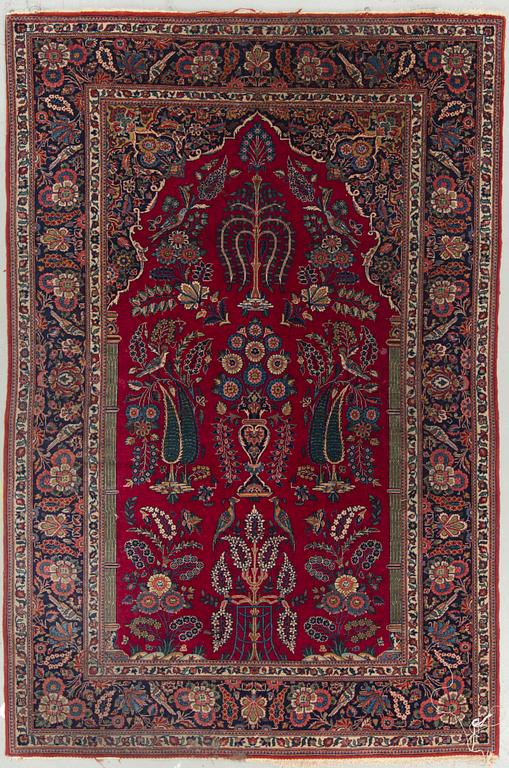 A semi-antique Kashan, around 204 x 136 cm.