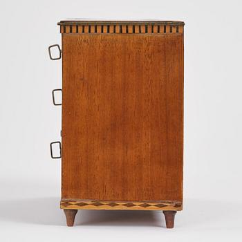 A Northern European mahogany miniature commode, early 19th century.