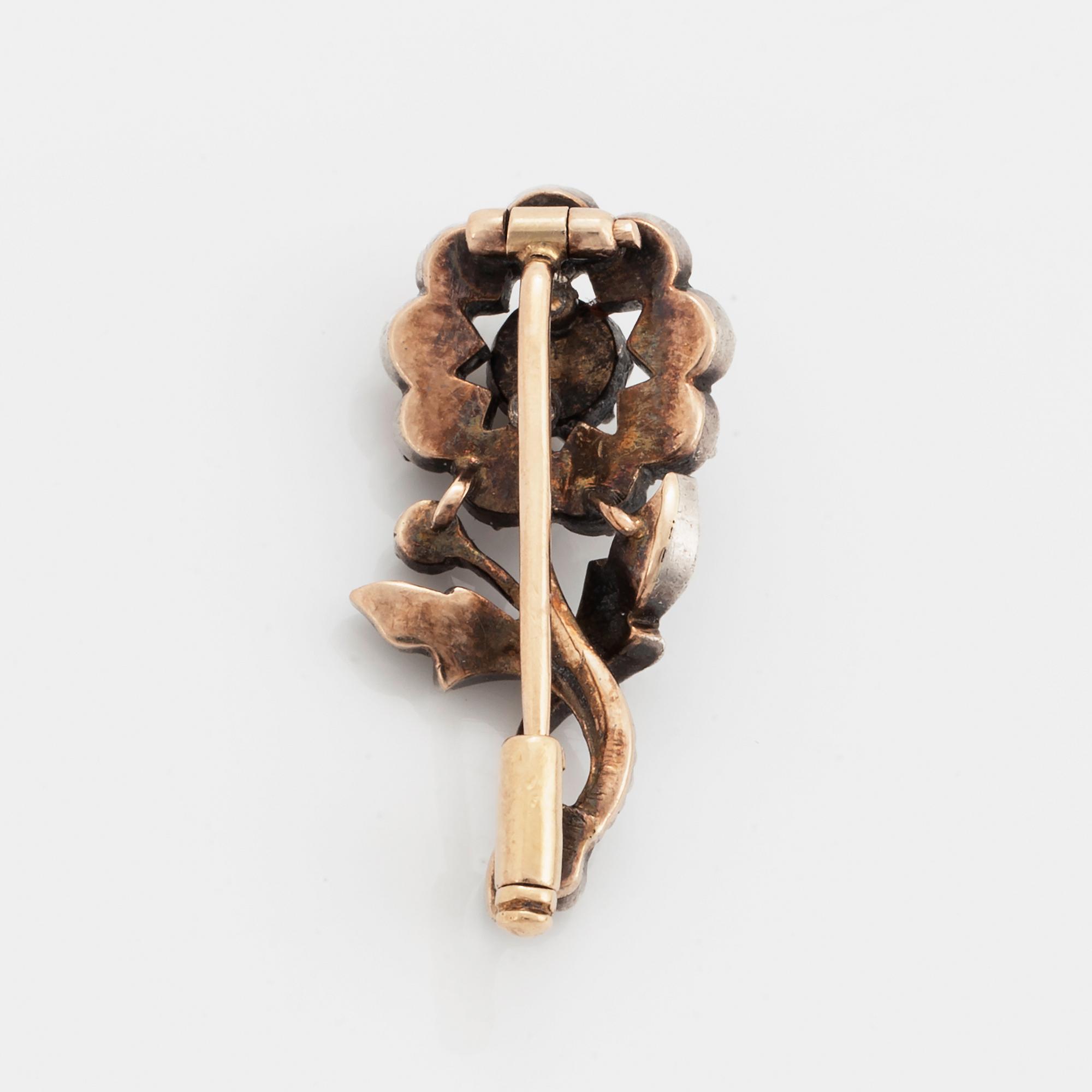 Rose-cut diamond flower brooch.