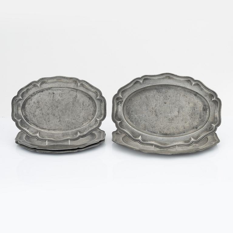 A set of six rococo pewter trays, mid 18th Century.