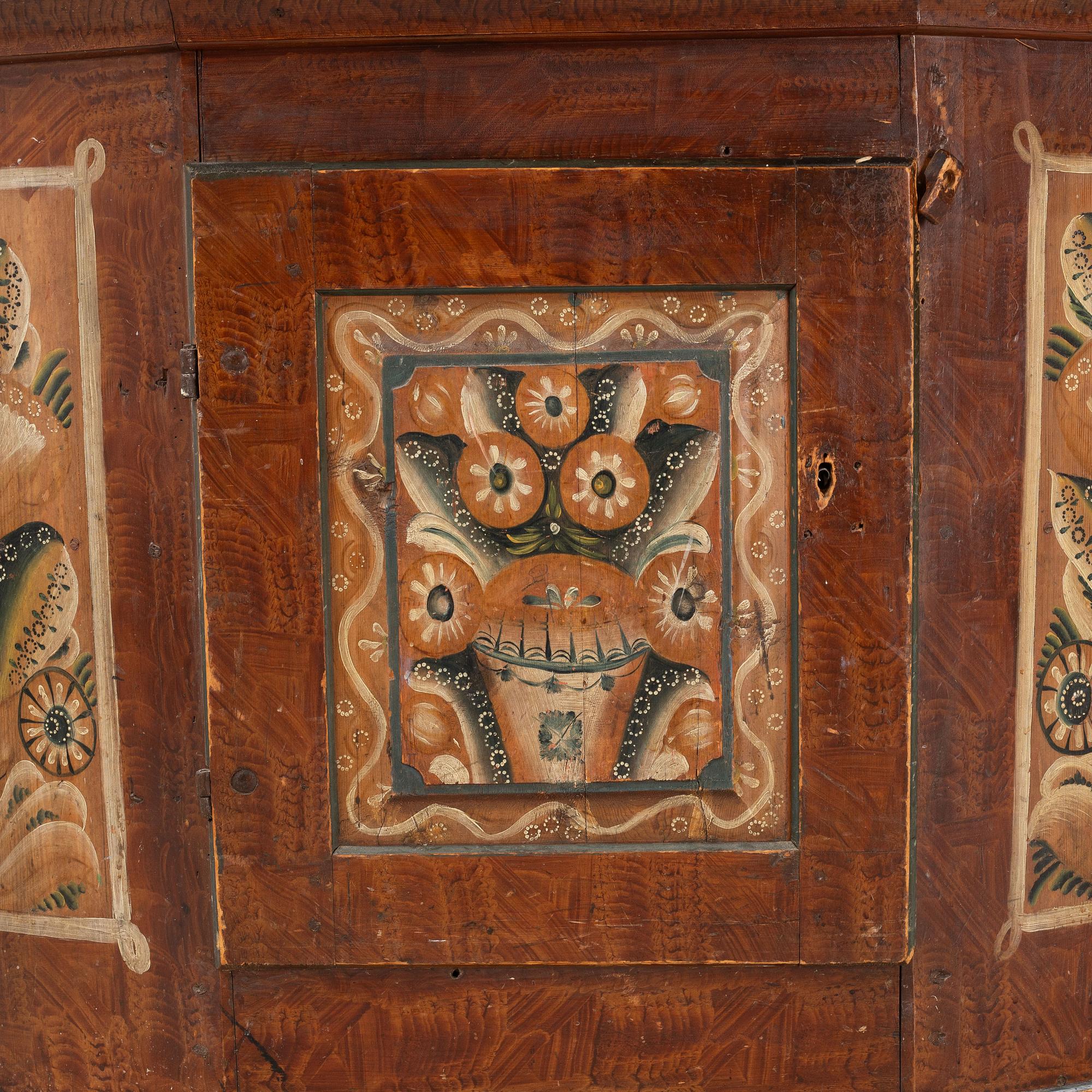 A Swedish traditional painted cabinet, dated 1819.