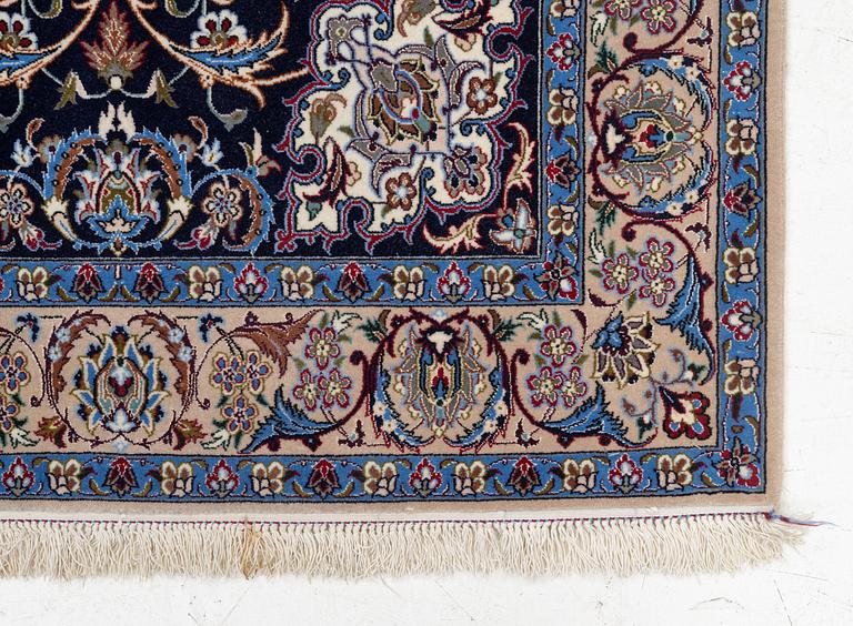 An Isfahan rug, signed, approx. 168 x 108 cm.