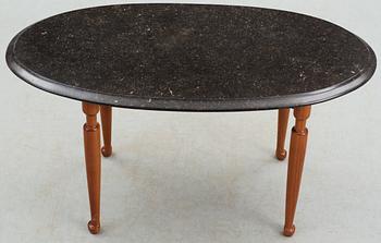 A Josef Frank black marble top and mahogany table by Svenskt Tenn.