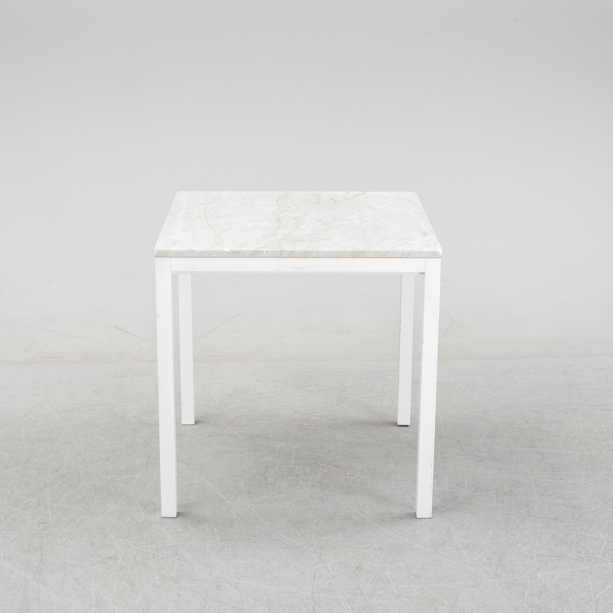 A marble top table, 21th century.