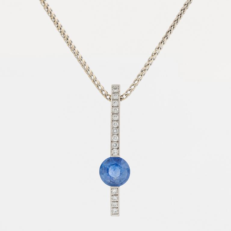 An 18K white gold necklace with a faceted sapphire.