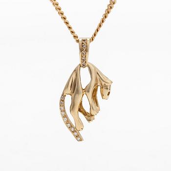 A 14K gold necklace with a panther pendant set with white stones.