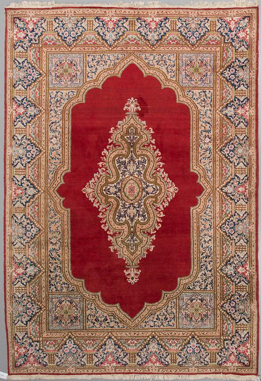 A carpet from Kerman, around 312 x 214 cm.