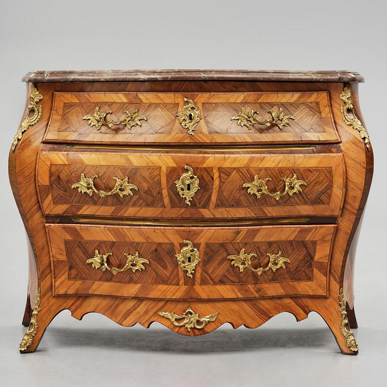 A rococo parquetry and gilt brass-mounted commode attrbuted to M. Engström (master in Stockholm 1758-97).