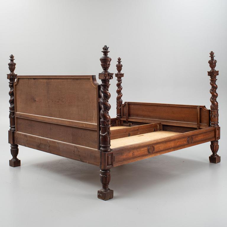 A carved Baroque style bed, early 20th Century.