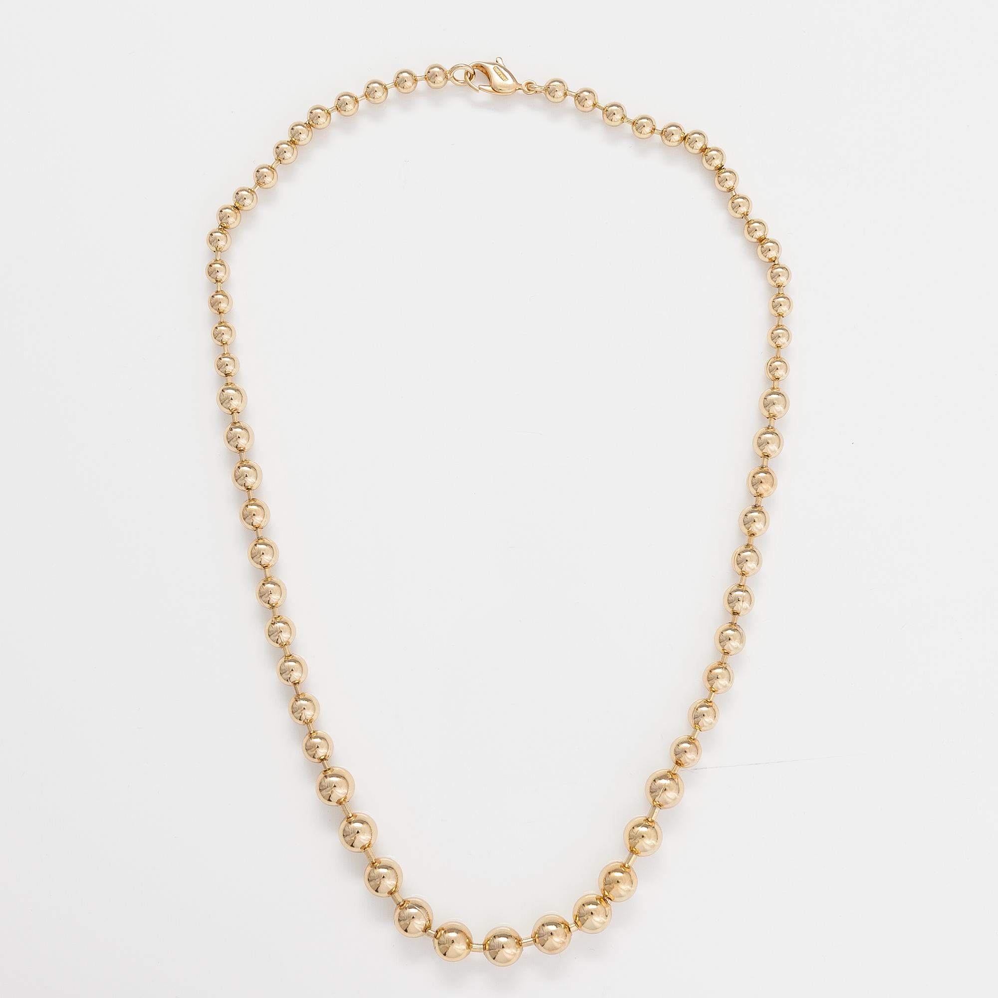 DIOR. A necklace and a pair of earrings in gold coloured metal. Marked Chr. Dior, Germany.