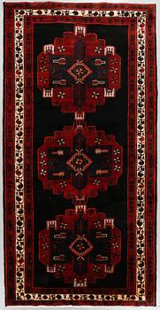 A rug from north west Persia, 284 x 153 cm.