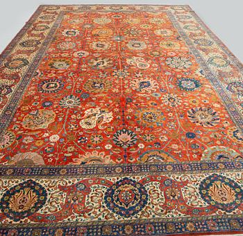 A carpet, a semi-antique Tabriz, ca 528-535 x 346,5-352,5 cm, signed Farhan.