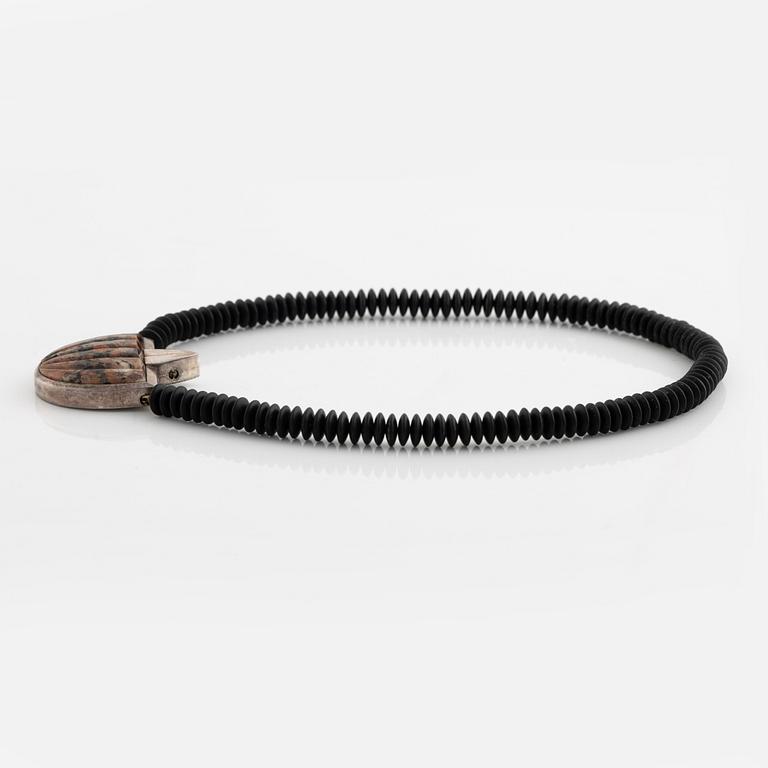 Gaudy necklace, silver and carved stone.