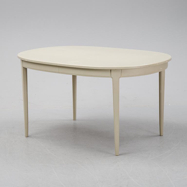 A dining table with two armchairs and six chairs by Carl Malmsten for Bodafors.