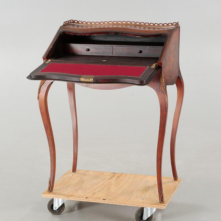 A Louis XV-style writers desk from the mid 20th century.