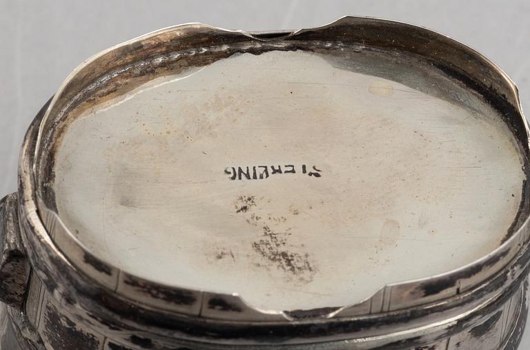 A set of three Japanese silver coasters and a pair of salts with shakers, 20th century.