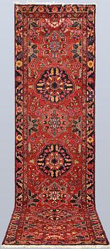 A semi-antique Heriz runner, c. 340 x 92 cm.