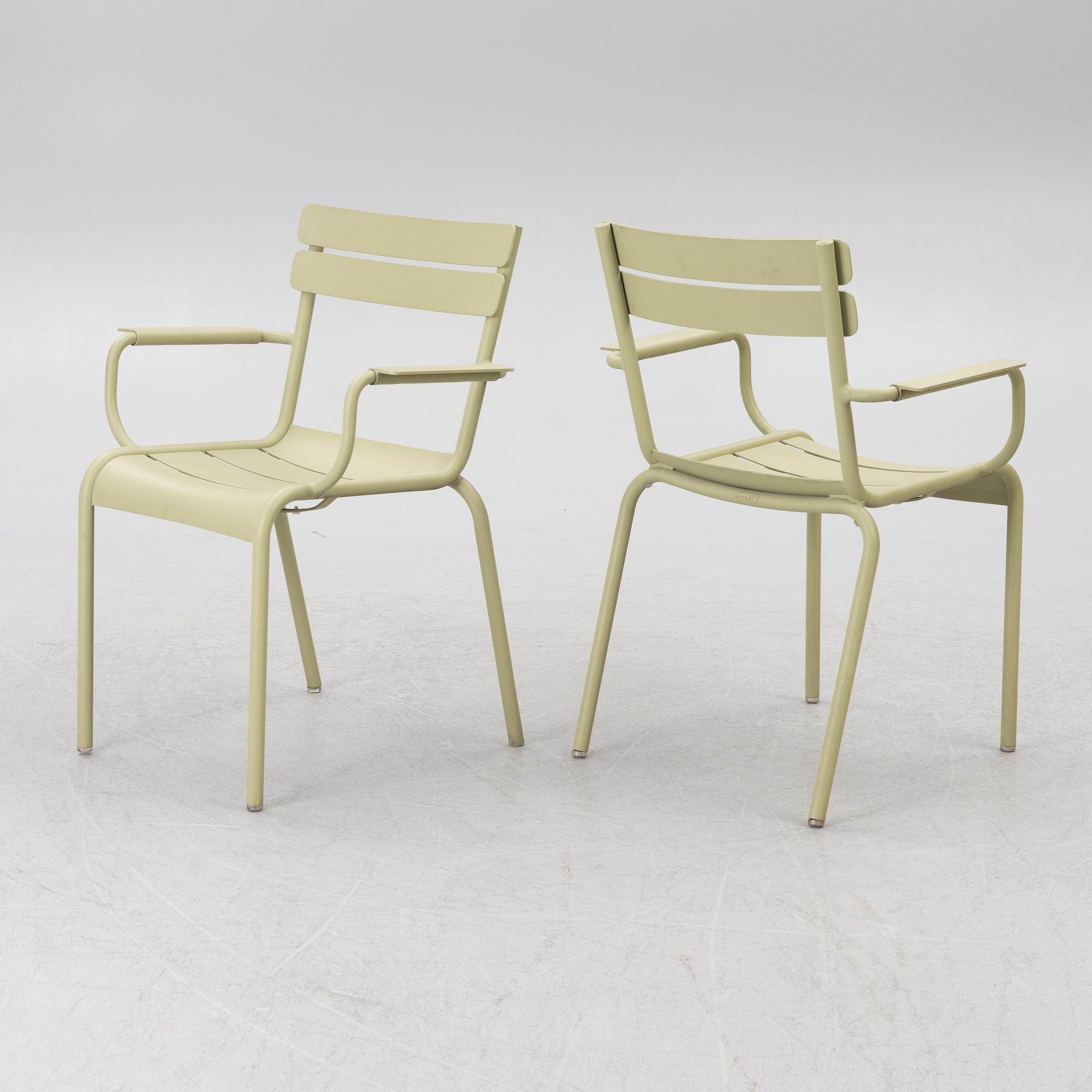 Frédéric Sofia, a table and two chairs for outdoor use, "Luxembourg" Fermob, France, 21st century.