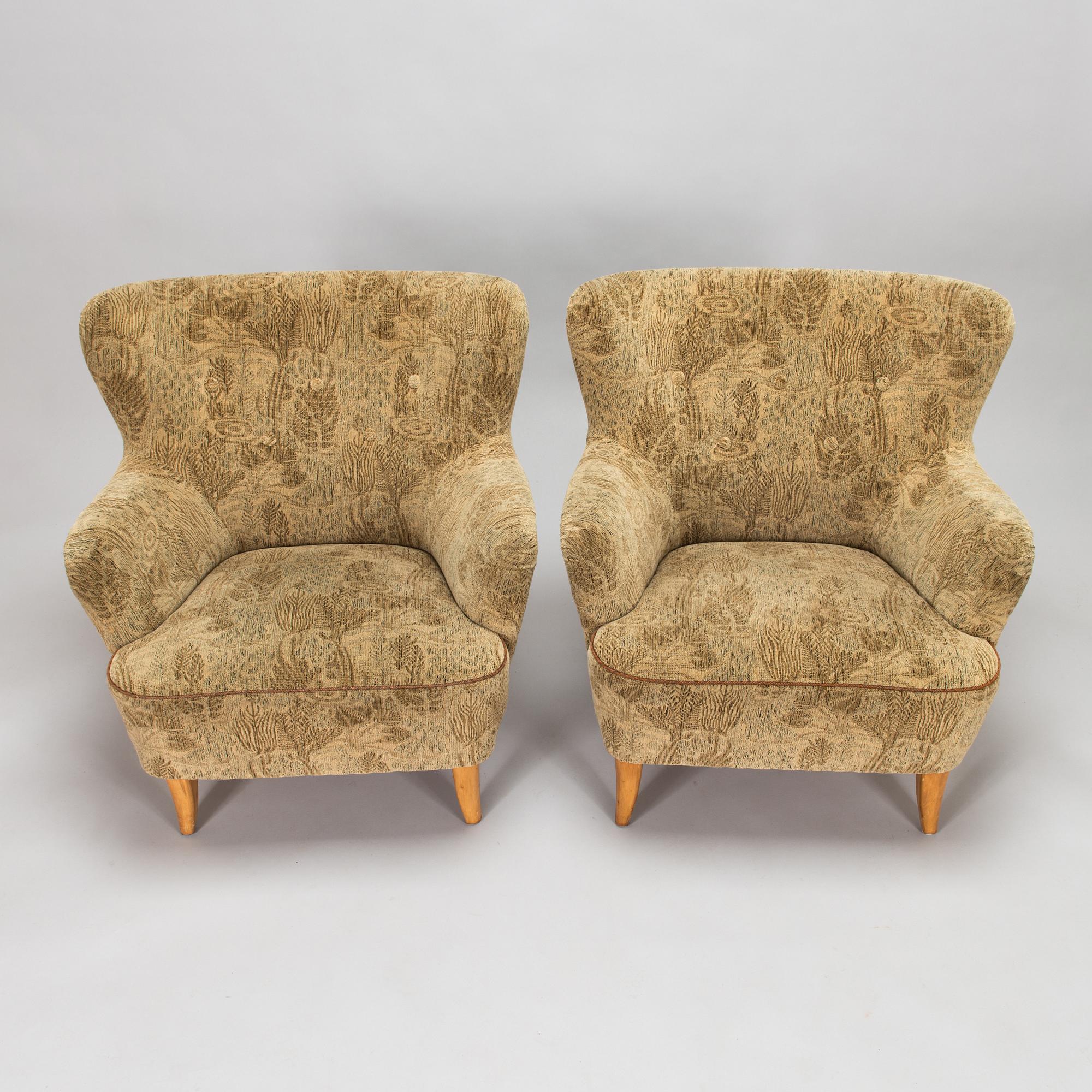A pair of 1950s armchairs.