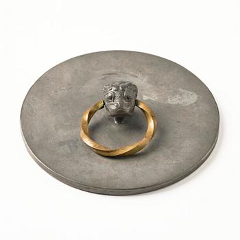 Firma Svenskt Tenn, a pewter hand mirror model A 1497 and a letter opener in the shape of an alligator, Stockholm, 1930s-40s.
