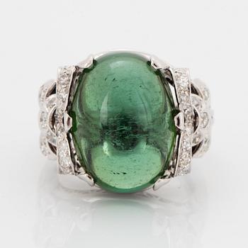 18K white gold diamond and green cabochon-cut tourmaline cocktail ring.