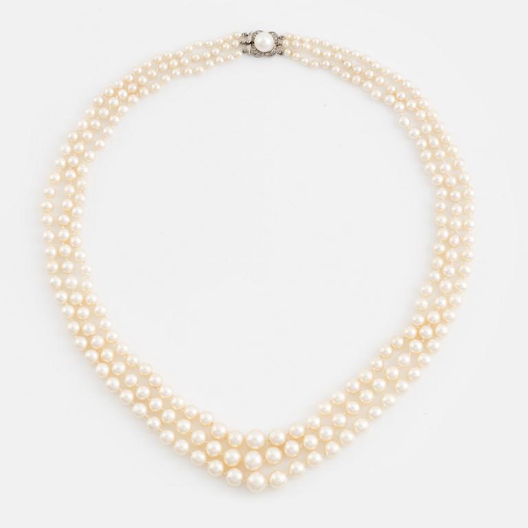 Three strand calibrated cultured pearl necklace, clasp with pearl and rose cut diamonds.