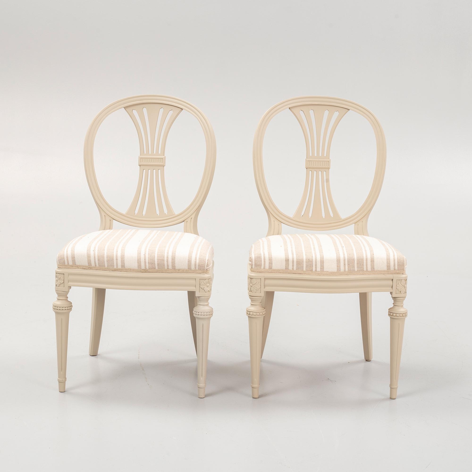 A Gustavian style dining table and eight chairs, late 20th Century.