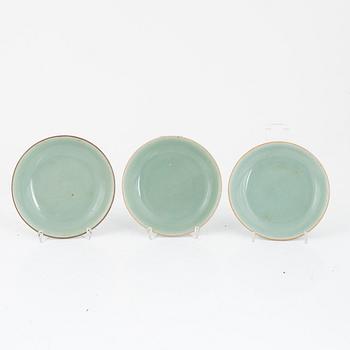 A set of three Chinese monochrome celadon porcelain dishes, Qing dynasty, 19th century.