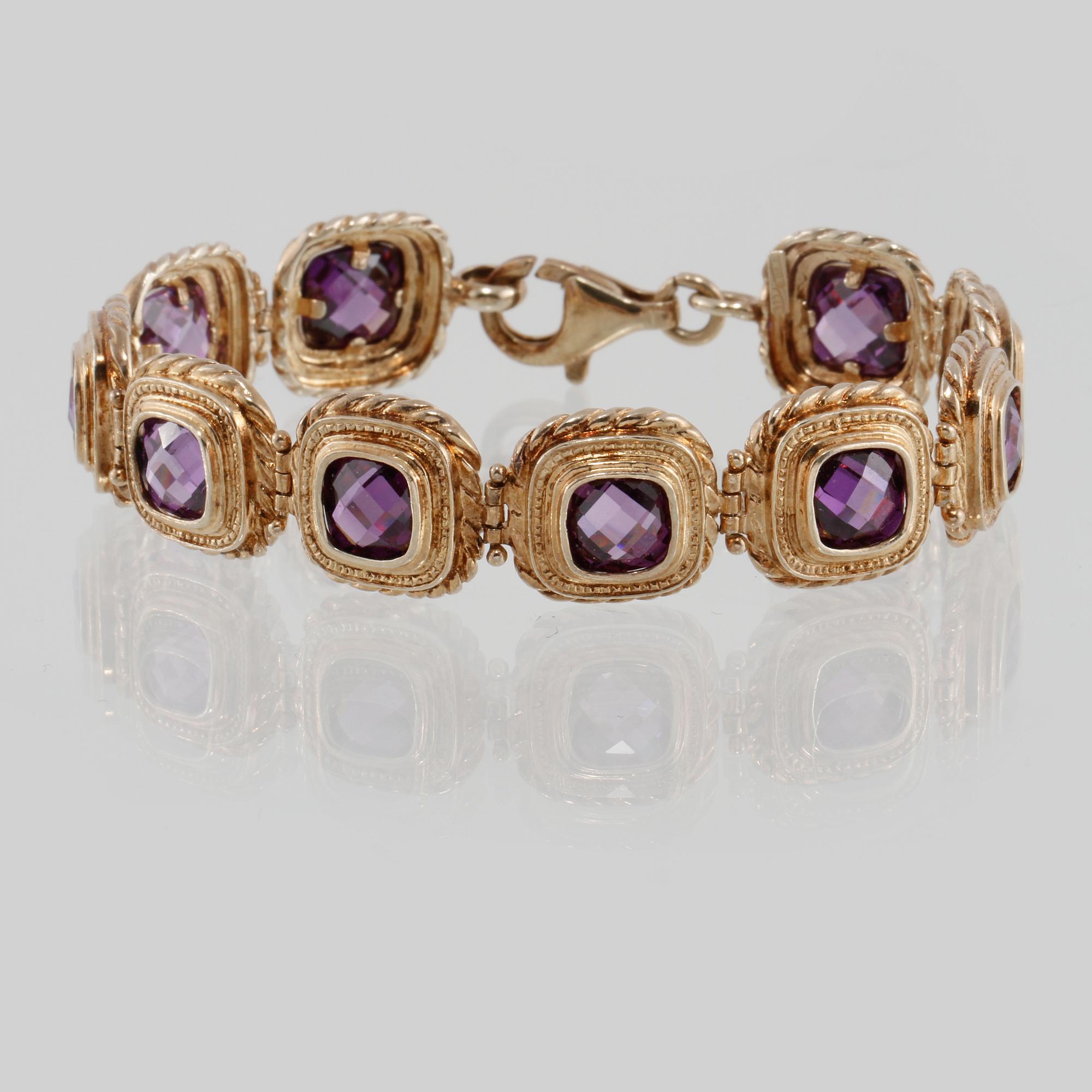 ARMBAND, förgyllt sterlingsilver med lila fasettslipade stenar. Vikt 30 gram.