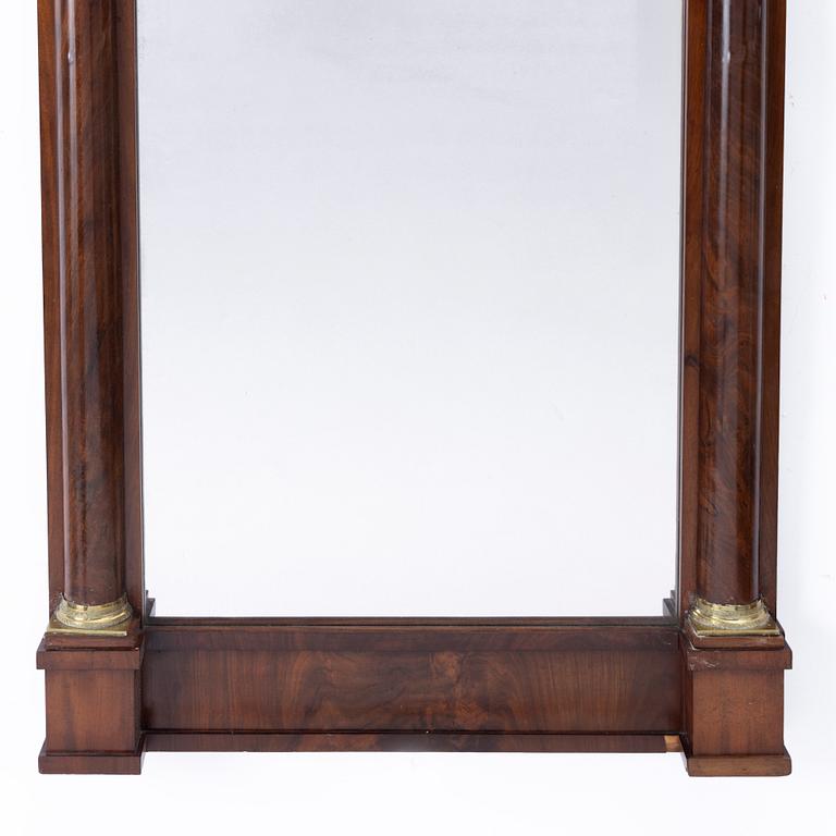 A Late Empire style mirror with a console table, second half of the 19th century.