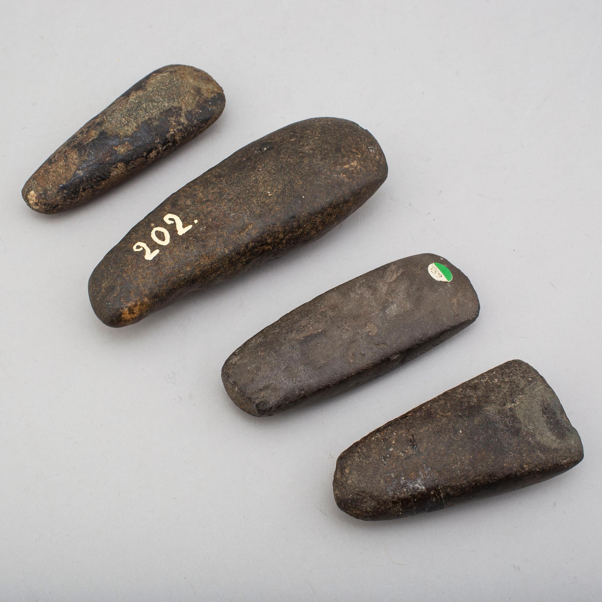 Four neolithic stone axes.