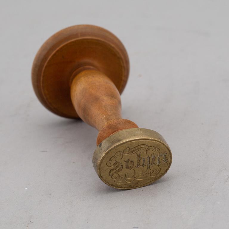 Four items with a royal provenance. Silver candlesticks, silver beaker, brass seal and a telegram.